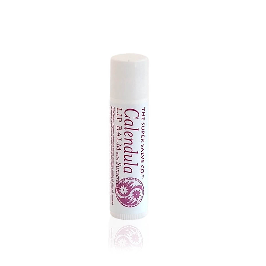 One tube of Calendula Lip Balm With Sunscreen from The Super Salve Co. is seen against a white background at Winter Sun Trading Co.