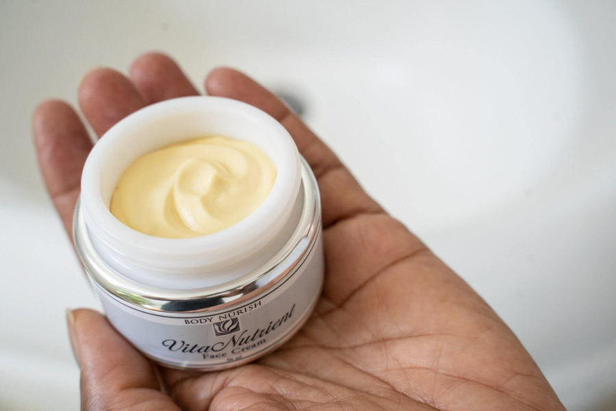 Vita Nutrient Face Cream is being held in a hand against a white background