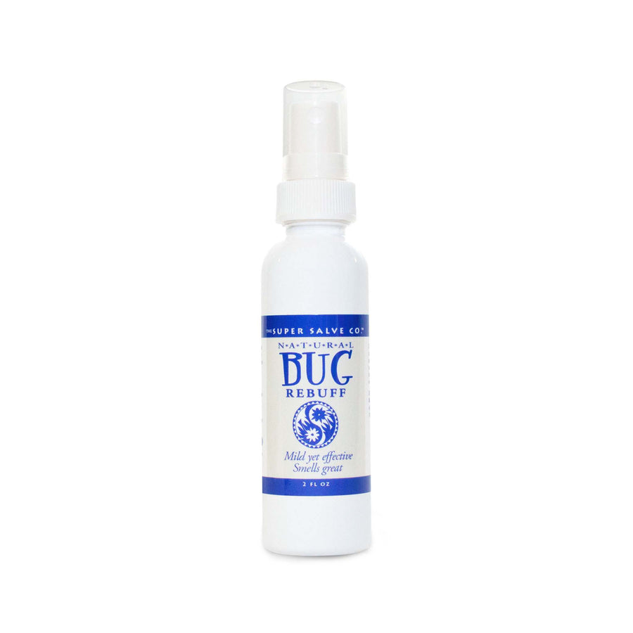A white spray-top bottle of natural insect repellent and bug spray from The Super Salve Co. is seen against a white backdrop at the Winter Sun Trading Co.