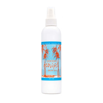 An 8 oz. white plastic bottle of Cocoa Mango Skin Oil from The Super Salve Co. is seen against a white backdrop at Winter Sun Trading Co.