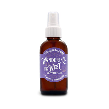 A brown 4 oz. bottle of Lavender and Frankincense hydrating face mist from Wandering The West is seen against a white background at Winter Sun Trading Co.