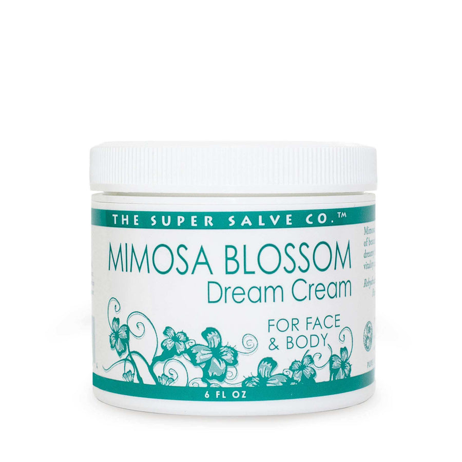 A 6 oz. container of Mimosa Blossom Dream Cream from the Super Salve Co. is seen against a white background at Winter Sun