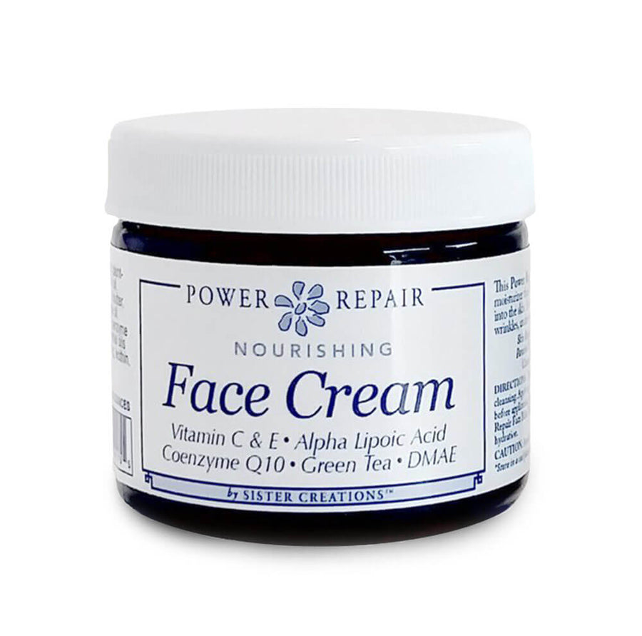 A 6 oz. blue container of Power Repair Face Cream by Sister Creations is seen against a white backdrop at Winter Sun Trading Co.